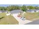 Beautiful ranch-style house with an attached garage and a white car parked in the driveway at 15303 Sw 52Nd Cir, Ocala, FL 34473