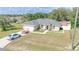 Beautiful ranch-style house with an attached garage and a red storage shed in the back at 15303 Sw 52Nd Cir, Ocala, FL 34473