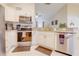 Modern kitchen featuring stainless steel appliances, white cabinets, and granite countertops at 15303 Sw 52Nd Cir, Ocala, FL 34473