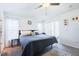 Bright bedroom with a ceiling fan, carpet, and access to the screened-in patio at 156 Carrera Ave, Davenport, FL 33897