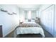 Inviting bedroom with a comfortable bed, soft lighting, and ample closet space for organized living at 156 Carrera Ave, Davenport, FL 33897