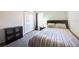 Cozy bedroom featuring neutral tones, carpeted floor, and a closet for ample storage at 156 Carrera Ave, Davenport, FL 33897