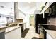Well-equipped kitchen with stainless steel appliances, granite countertops, and ample cabinet space at 156 Carrera Ave, Davenport, FL 33897