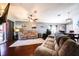 Spacious living room offering a relaxing atmosphere with plush sofas, hardwood floors, and plenty of natural light at 156 Carrera Ave, Davenport, FL 33897