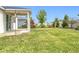 Well-maintained backyard features lush green grass, landscaping, and white vinyl privacy fence at 15865 Bradicks Ct, Clermont, FL 34711