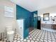 Modern bathroom featuring dual vanities, stand-alone glass shower, and tile flooring at 15865 Bradicks Ct, Clermont, FL 34711