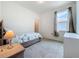 Cozy bedroom with warm lighting, neutral colors, and comfortable furniture at 15865 Bradicks Ct, Clermont, FL 34711