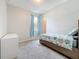 Bedroom with coastal-themed bedding, window, and natural light at 15865 Bradicks Ct, Clermont, FL 34711