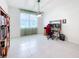 Bright flex room with a large window and neutral décor, perfect for a home office at 15865 Bradicks Ct, Clermont, FL 34711