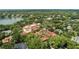 Expansive estate features a beautiful pool, gardens, and boat dock, surrounded by serene water at 1602 Alabama Dr # Ph404, Winter Park, FL 32789