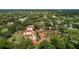 Expansive aerial view showcasing the beautiful property and surrounding lush landscape with terracotta tile roofing at 1602 Alabama Dr # Ph404, Winter Park, FL 32789