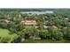 Stunning aerial view of a lakeside property with well-maintained landscaping and waterfront access at 1602 Alabama Dr # Ph404, Winter Park, FL 32789