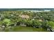 Scenic aerial shot of a lakeside home with lush greenery, private boat docks and stunning lake views at 1602 Alabama Dr # Ph404, Winter Park, FL 32789