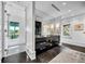 Bright primary bathroom with marble vanity and dark herringbone floors next to a modern shower and soaking tub at 1602 Alabama Dr # Ph404, Winter Park, FL 32789