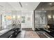 Modern primary bathroom with dark cabinets, black marble countertop, and large mirrors for ample grooming space at 1602 Alabama Dr # Ph404, Winter Park, FL 32789