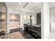 Elegant bathroom featuring a double vanity with marble countertops and a luxurious closet at 1602 Alabama Dr # Ph404, Winter Park, FL 32789