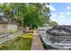 Boat dock featuring multiple boat slips, a platform deck, and stairs to a deck area at 1602 Alabama Dr # Ph404, Winter Park, FL 32789