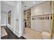 A closet featuring a wall of shelving and drawers, with fashionable decor at 1602 Alabama Dr # Ph404, Winter Park, FL 32789