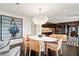 Dining area featuring a modern chandelier, stylish chairs, and open view to the kitchen at 1602 Alabama Dr # Ph404, Winter Park, FL 32789