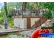 Lake house with a private dock and boathouse featuring a lakeside deck and stair access at 1602 Alabama Dr # Ph404, Winter Park, FL 32789