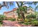 Luxury hotel with a brick driveway surrounded by lush landscaping and multiple floors at 1602 Alabama Dr # Ph404, Winter Park, FL 32789