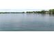 Serene lake view featuring calm, expansive waters and distant treelined shore at 1602 Alabama Dr # Ph404, Winter Park, FL 32789
