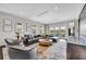 Spacious living room with comfortable seating, scenic views, and modern decor at 1602 Alabama Dr # Ph404, Winter Park, FL 32789