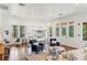 Open-concept living area with a kitchen, wood floors and stylish furnishings for comfortable living at 1602 Alabama Dr # Ph404, Winter Park, FL 32789