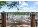 Lakeside deck featuring outdoor seating with a serene view of the water and lush greenery at 1602 Alabama Dr # Ph404, Winter Park, FL 32789