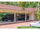 Covered parking garage featuring multiple parking spaces and a brick driveway at 1602 Alabama Dr # Ph404, Winter Park, FL 32789