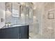 Modern powder room featuring geometric patterned walls, sleek vanity, and stylish lighting fixtures at 1602 Alabama Dr # Ph404, Winter Park, FL 32789