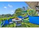 Relaxing rooftop deck with comfortable seating, vibrant greenery, and scenic views under a sunny sky at 1602 Alabama Dr # Ph404, Winter Park, FL 32789