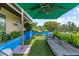 Comfortable patio seating with green umbrella at 1602 Alabama Dr # Ph404, Winter Park, FL 32789