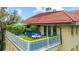 Charming rooftop terrace with lush greenery, elegant seating, and a beautiful red-tiled roof at 1602 Alabama Dr # Ph404, Winter Park, FL 32789