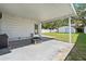 Spacious back patio with a fire pit and covered roof at 1623 Cumbie Ave, Orlando, FL 32804