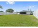 Large backyard with a white fence at 1623 Cumbie Ave, Orlando, FL 32804