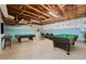 Spacious finished basement with a billiards area and seating area at 1623 Cumbie Ave, Orlando, FL 32804