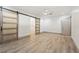 Spacious bedroom featuring light laminate flooring, fresh paint and large closet with barn door at 1623 Cumbie Ave, Orlando, FL 32804