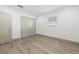 Bedroom with laminated flooring, fresh paint, base trim and double door closet at 1623 Cumbie Ave, Orlando, FL 32804