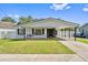 Charming single-story home with a well-maintained lawn and a convenient carport at 1623 Cumbie Ave, Orlando, FL 32804