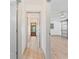 Hallway leading into a bedroom with sliding barn doors, new ceiling fan and fresh paint at 1623 Cumbie Ave, Orlando, FL 32804