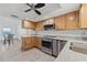 Modern kitchen with wooden cabinets, stainless steel appliances, and granite countertops at 1623 Cumbie Ave, Orlando, FL 32804
