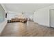 Spacious living room features vinyl flooring, a large sectional couch, and natural lighting at 1623 Cumbie Ave, Orlando, FL 32804