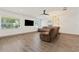 Cozy living room boasts a large TV, comfortable seating, and ample natural light at 1623 Cumbie Ave, Orlando, FL 32804