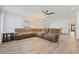 Bright living room featuring vinyl flooring, a comfortable sectional, and ample natural light at 1623 Cumbie Ave, Orlando, FL 32804
