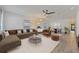 Bright and airy living room with modern furnishings, neutral tones, and an open layout to the dining area at 1623 Cumbie Ave, Orlando, FL 32804