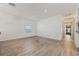 Large living area with hardwood floors, white walls, window and bright lighting at 1623 Cumbie Ave, Orlando, FL 32804