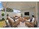 Well decorated outdoor living space under a lanai, perfect for relaxing or entertaining at 1623 Cumbie Ave, Orlando, FL 32804