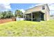 Exterior view of home, showcasing screened lanai and spacious backyard at 16334 Saint Augustine St, Clermont, FL 34714