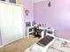 Comfortable bedroom boasts a closet, desk, and soft carpet at 16334 Saint Augustine St, Clermont, FL 34714